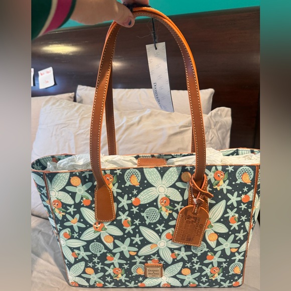 Dooney & Bourke Disney park purchase featuring Orange Bird